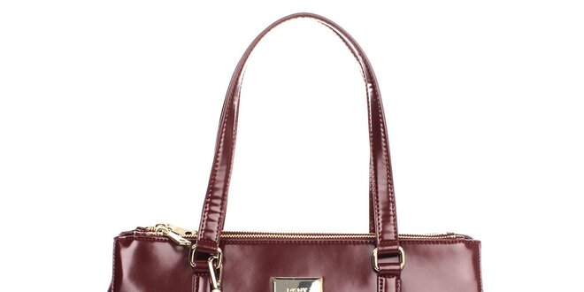 Dámska kožená kabelka vo vínovom odtieni s guľatým príveskom DKNY
