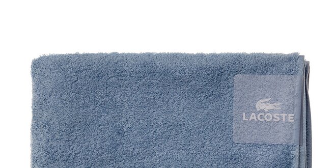 Väčší blankytne modrý uterák Lacoste