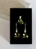 Strieborná súprava Crystals from Swarovski MIDI TRIANGLE | Luminous Green / žiarivá žlto-zelená